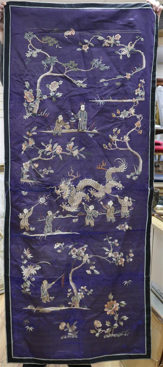 A Chinese silk embroidered panel, worked with figures, dragons and peonies, on a purple ground